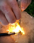 Elevated Survival Rope Wick and Bellow. Hemp rope wick fire starter by Elevated Survival is infused with parafin wax to easily light using the Arc Ignite Lighter or Fire Stick by Elevated Survival. Close Up with Spark.