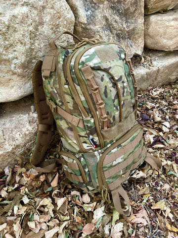 Traditional Camo Backpack by Elevated Survival. MOLLE system straps. Survival backpack perfect for hiking, survival, camping, backpacking, and climbing.